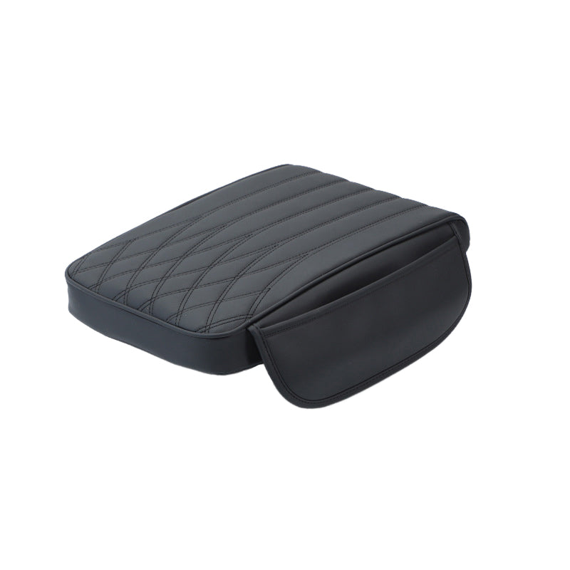 Adjustable universal leather armrest cushion, enhancing driving aid and vehicle interior.