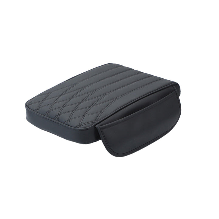 Adjustable universal leather armrest cushion, enhancing driving aid and vehicle interior.