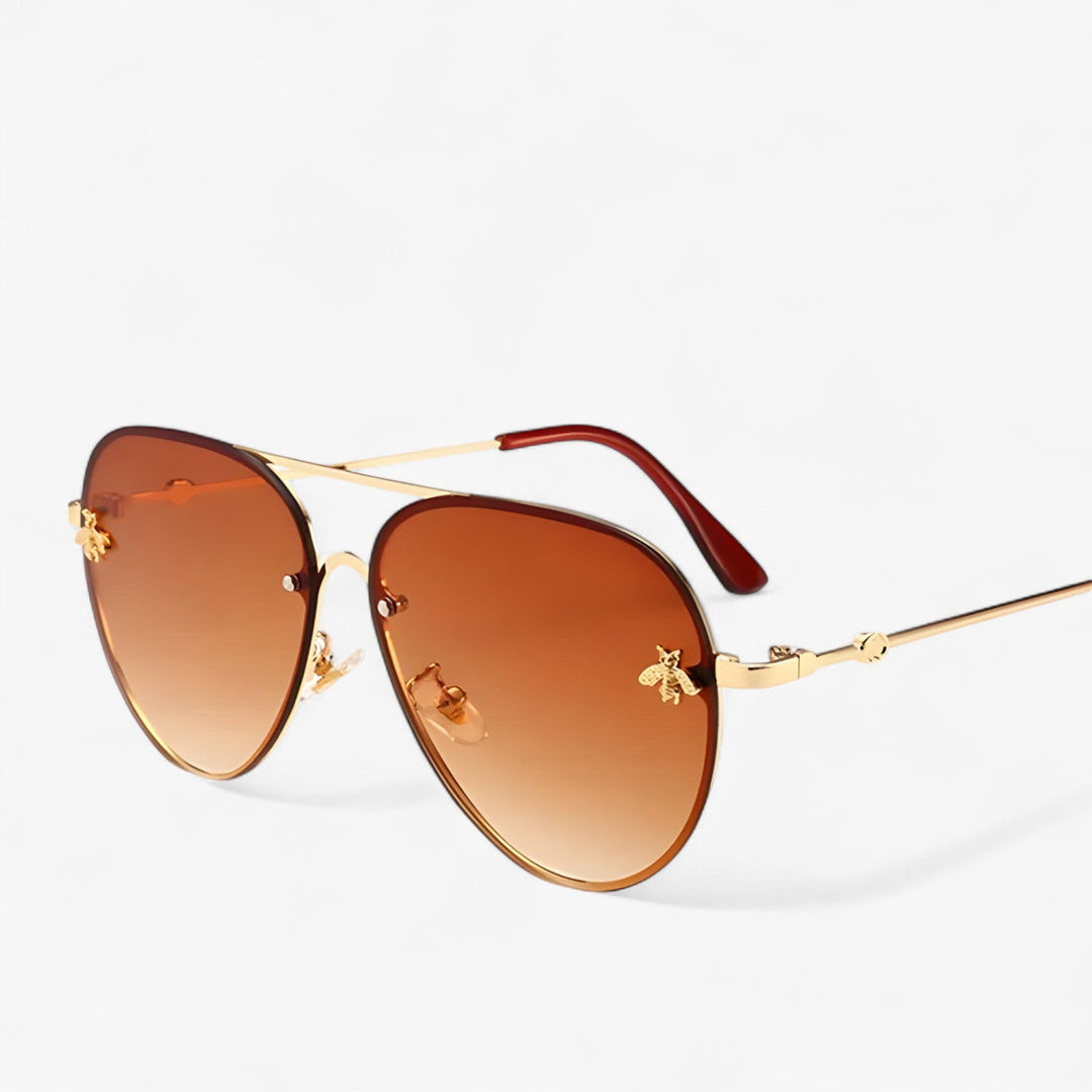 Chic vintage aviator sunglasses with a delicate bee detail, offering UV400 protection.