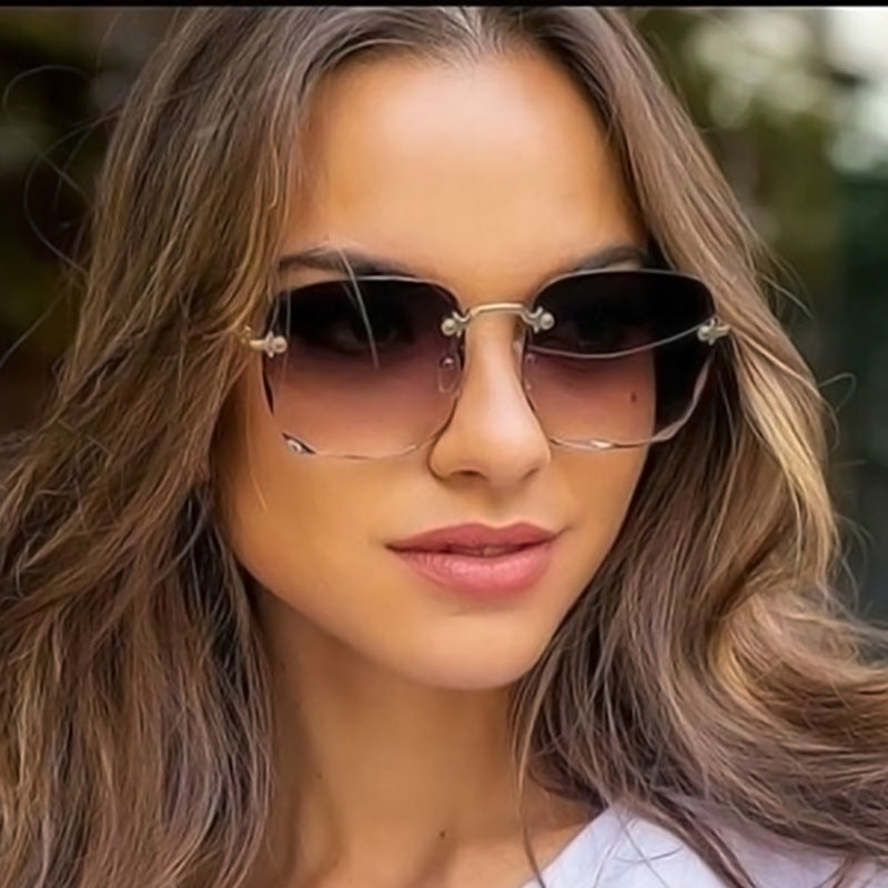 Unisex vintage rimless sunglasses with UV400 protection, featuring trendy square lenses.