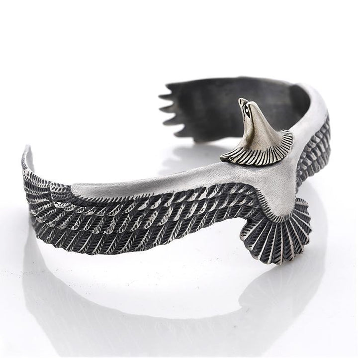 Lifestyle image featuring the adjustable eagle bracelet on a wrist, blending with other fashion accessories.
