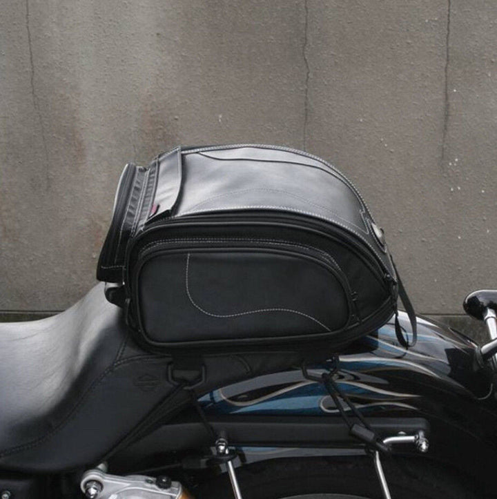 Securely mounted motorcycle tail bag with expandable storage, water-resistant for all-weather riding.
