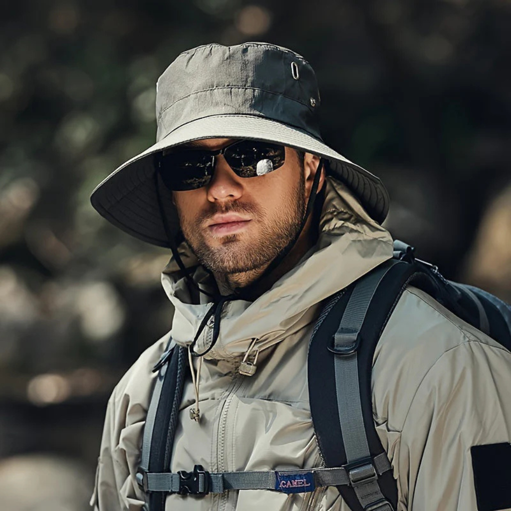 Foldable, adjustable unisex sun hat with wide brim for superior UV protection during outdoor activities.