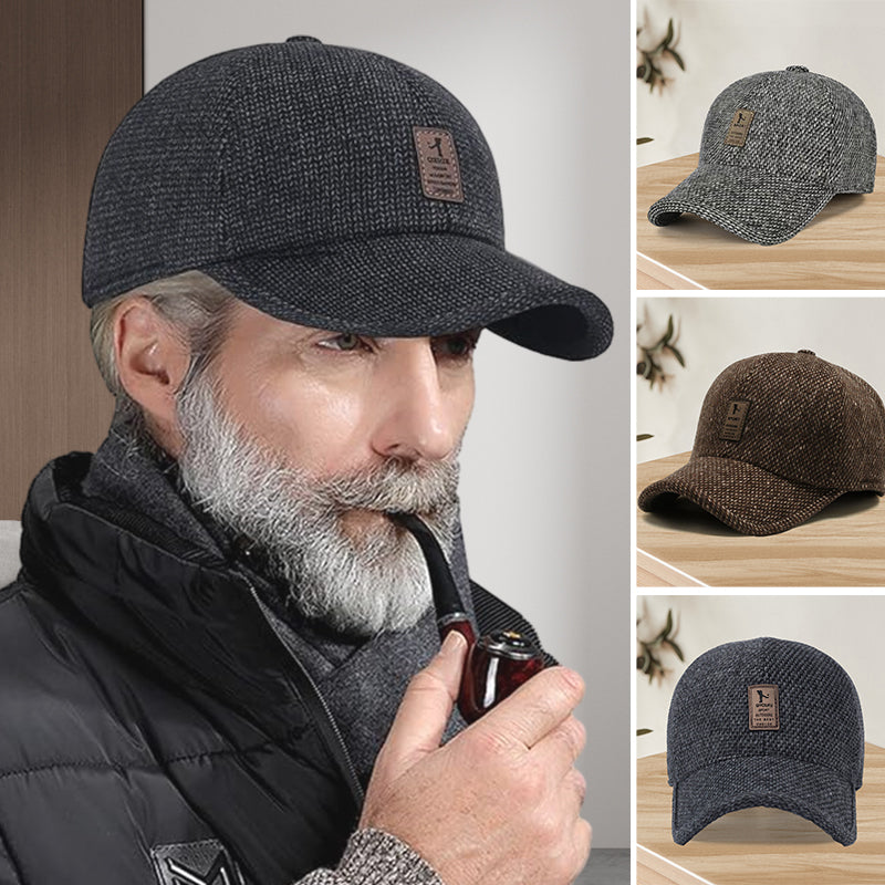 Side view of unisex winter baseball cap showing unfolded ear flaps, black wool blend, cold weather sports cap