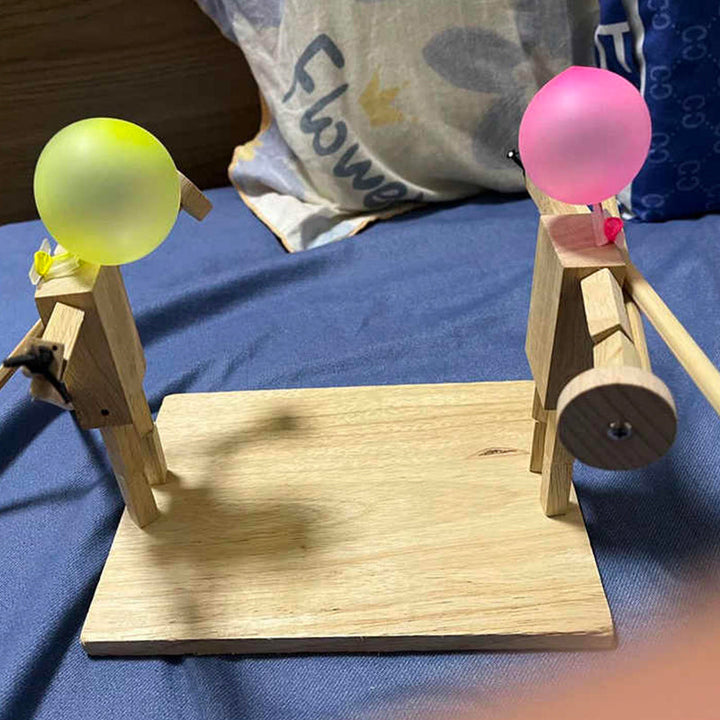 Detailed shot of a wooden battle bot, showing craftsmanship and balloon attachment, novelty toy