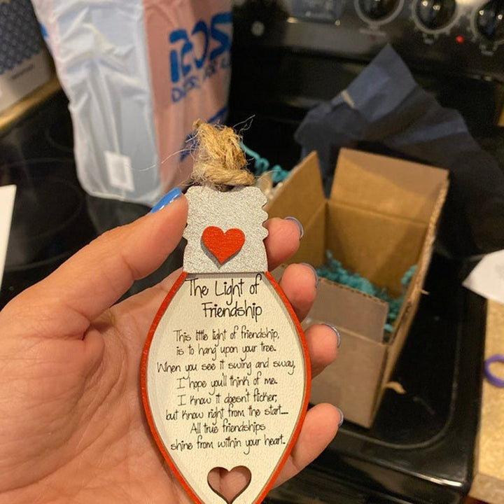 Close-up of wooden friendship ornament, handcrafted keepsake for best friends, engraved detail