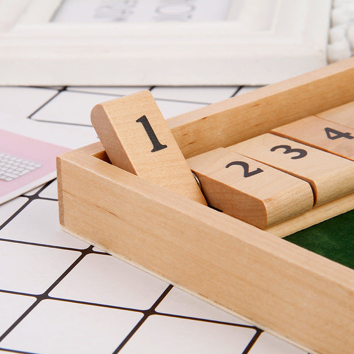 Detail shot of the dice and numbered tiles of a unisex table math game, a great gift