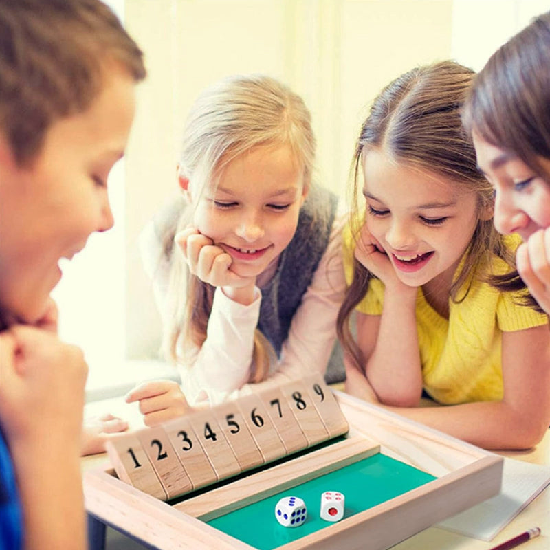 Two generations playing a wooden dice math game, showcasing intergenerational family fun