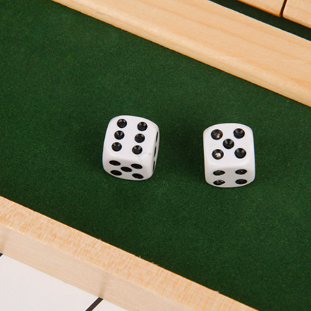 Colorful dice used in a unisex table math game, adding excitement to educational play