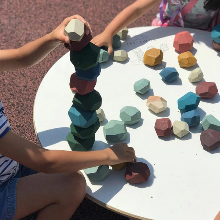 Close-up of colorful wooden stacking stones, educational toy for kids' balance