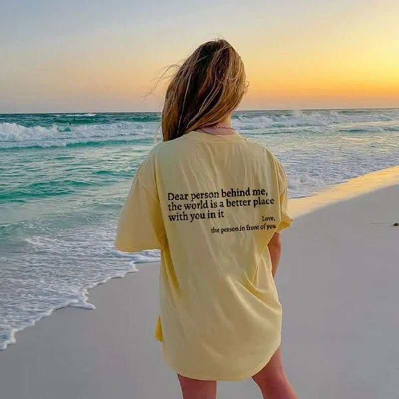 Model smiling in the 'You Are Enough' inspirational cotton tee, representing comfort wear.