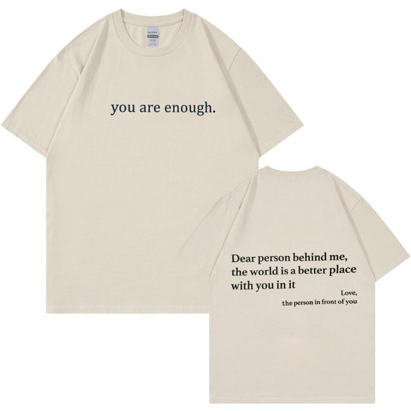Arrangement of the 'You Are Enough' t-shirt with accessories, emphasizing casual style.