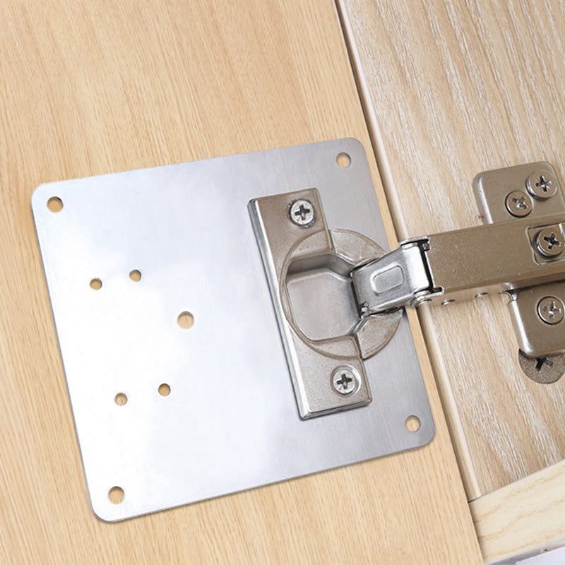 Cabinet door with damaged hinge fixed using the Universal Cabinet Hinge Repair Plate Kit, a home improvement solution