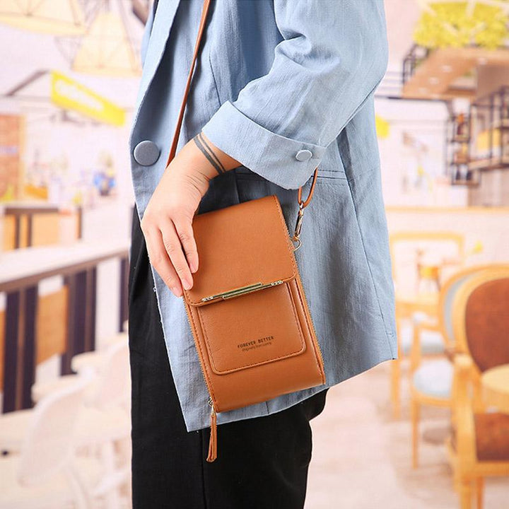 Compact versatile crossbody phone case in tan PU leather. Mini bag with wallet features for iPhone/Android. Stylish travel.