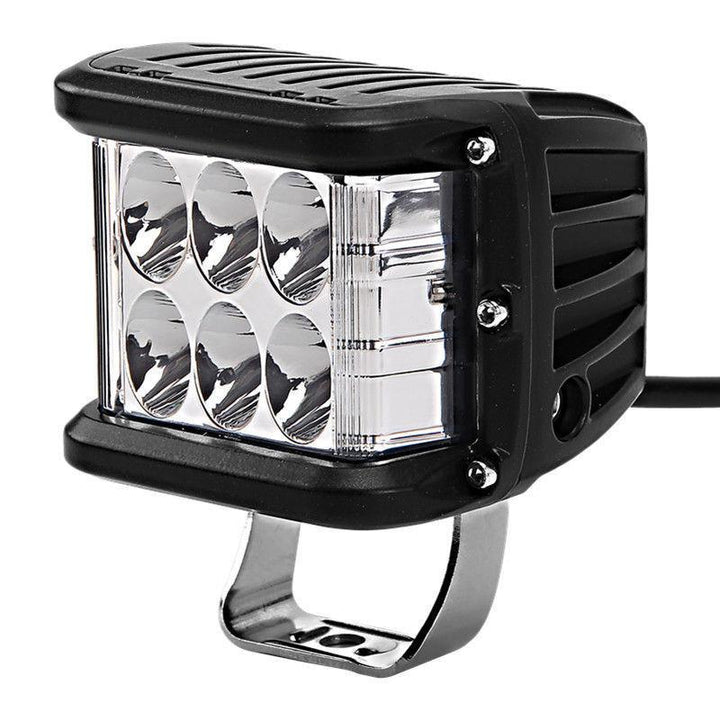 Close-up of a universal dual color LED pod light, showcasing durable housing and bright LEDs