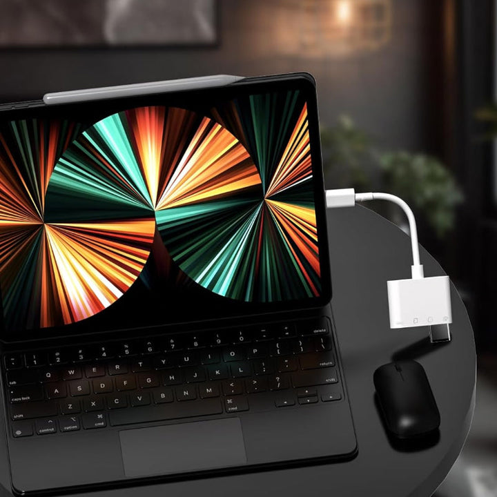 Universal mobile memory card reader with a laptop and smartphone, displaying its versatility in data management