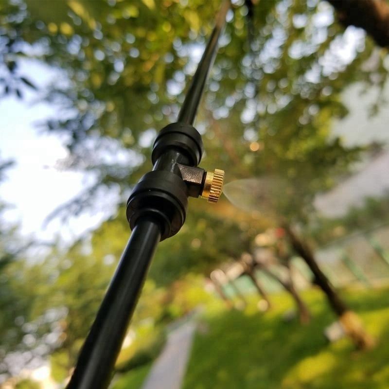 Patio misting cooling system with adjustable nozzles for summer temperature control