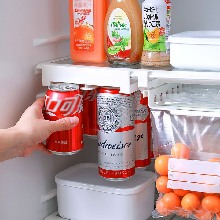 Clear can dispenser rack for pantry organization, keeps drinks neat.