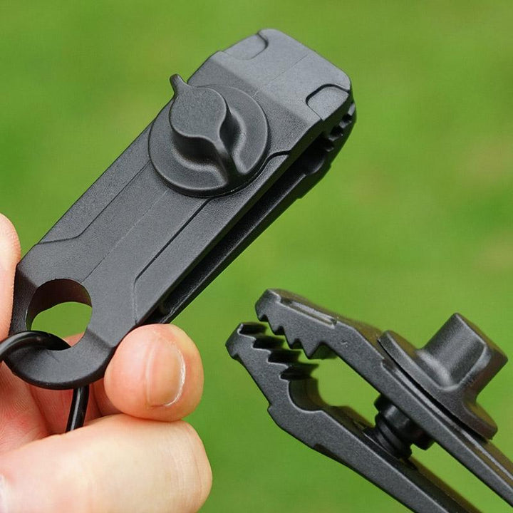 Close-up of a reusable tarp clip showcasing its strong grip for awnings, tents & boat covers.