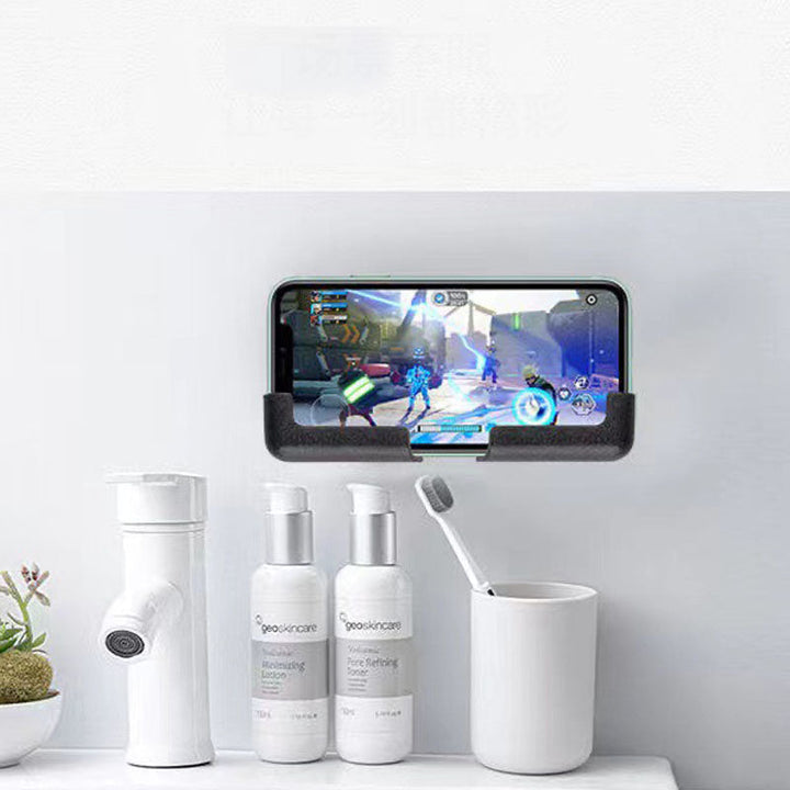 Tablet stand with adhesive base holding a tablet upright on a kitchen counter for recipes