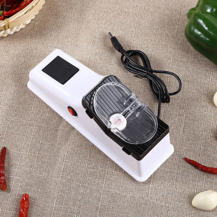 USB electric kitchen knife sharpener, illustrating its compact size and efficiency