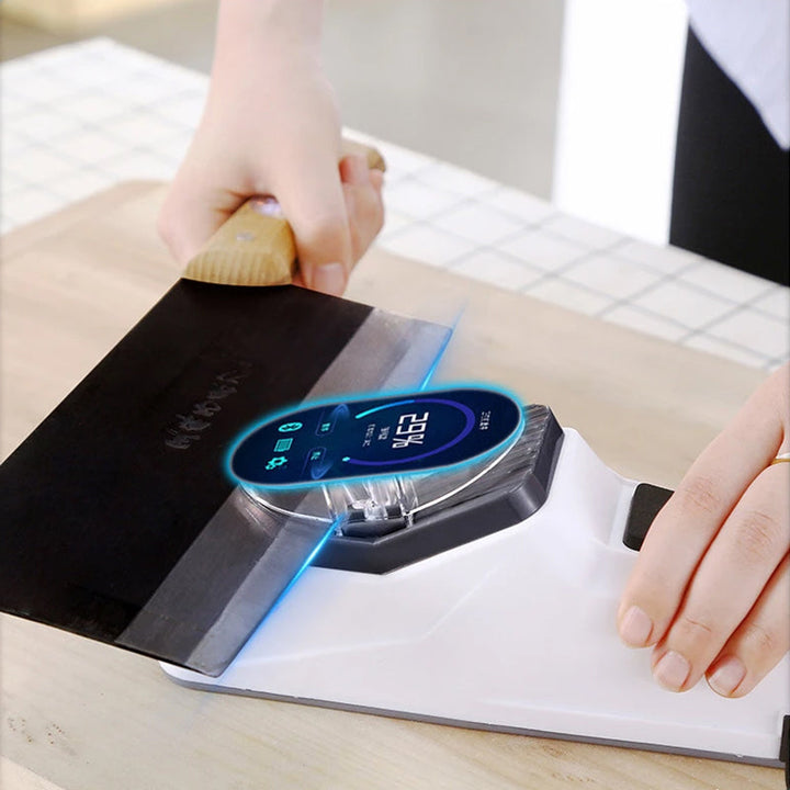 Close-up of USB electric knife sharpener with a chef's knife in sharpening slot