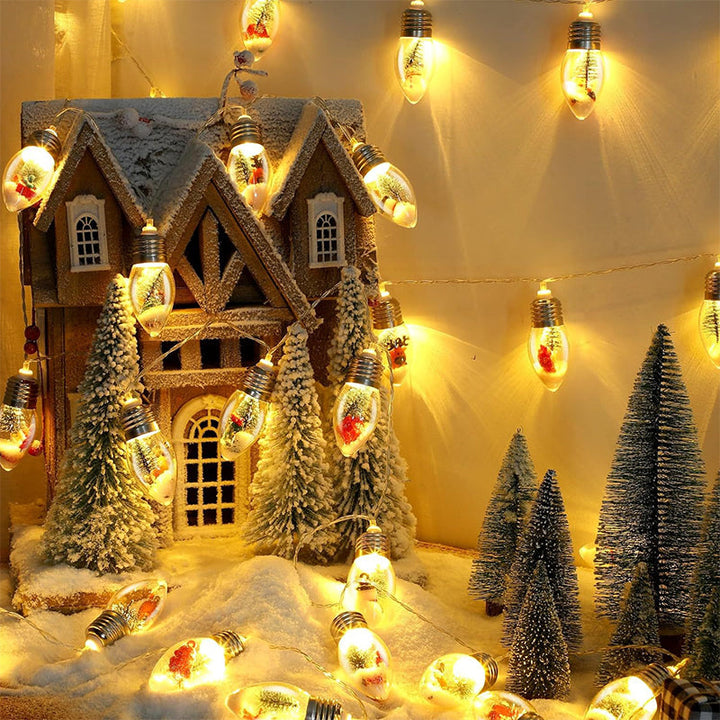 Close-up of a glowing Santa Claus character on USB-powered LED Christmas fairy string lights