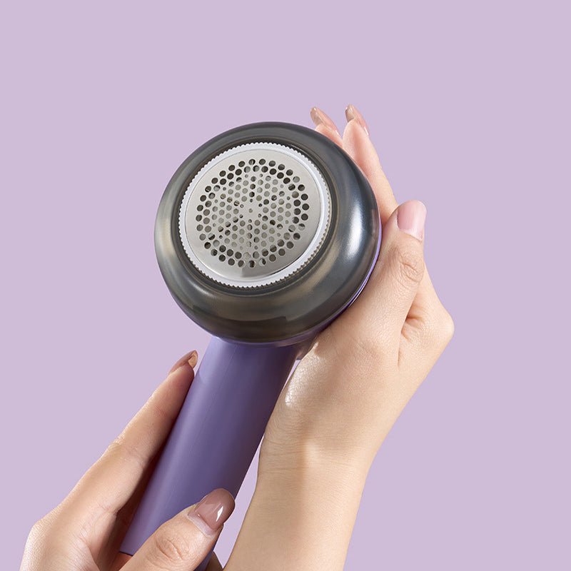 Compact and portable fabric defuzzer, ideal for travel and quick refresh of clothing.