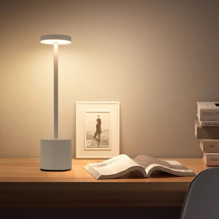 High-angle view of the minimalist design of the USB rechargeable touch dimmable LED lamp
