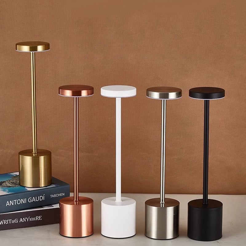 Sleek white LED table lamp with touch control, illuminated, providing a soft glow in a living room