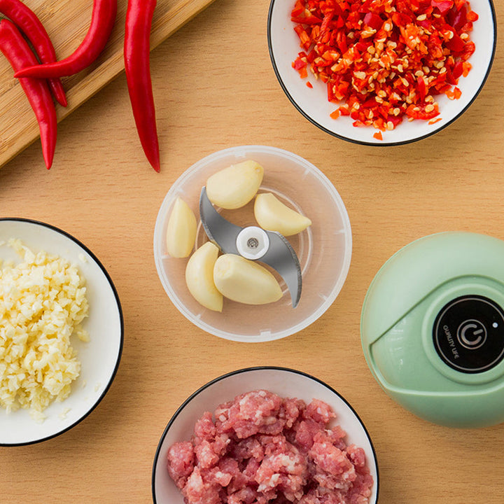 Versatile USB rechargeable mini blender for onions, garlic, and herbs. Effortless food prep.