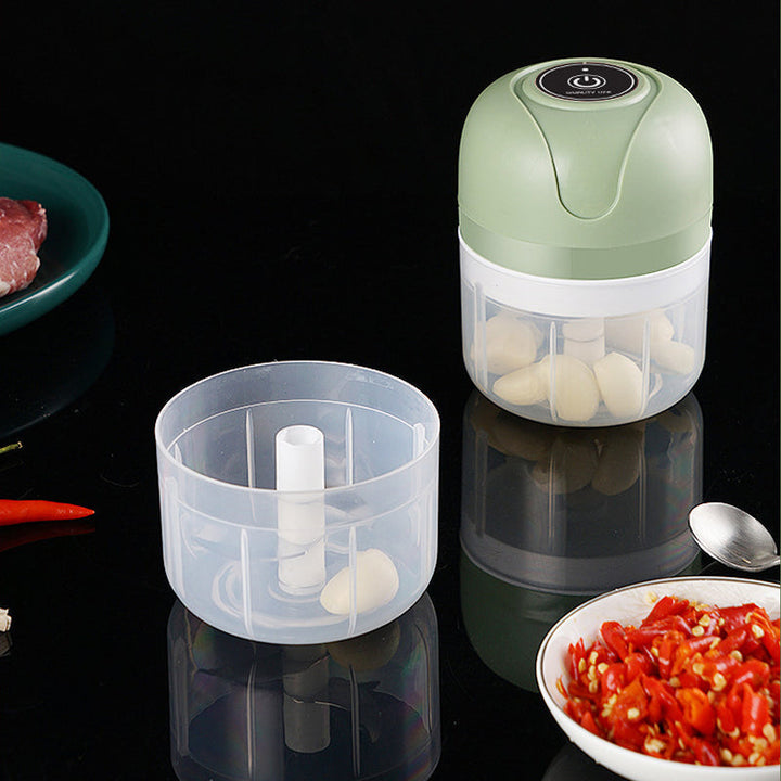 Compact electric food mincer with USB charging, perfect for quick food prep tasks. Black finish.