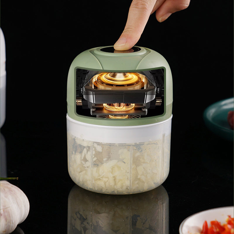 Electric food grinder, USB powered, ideal for making baby food or mincing garlic quickly.
