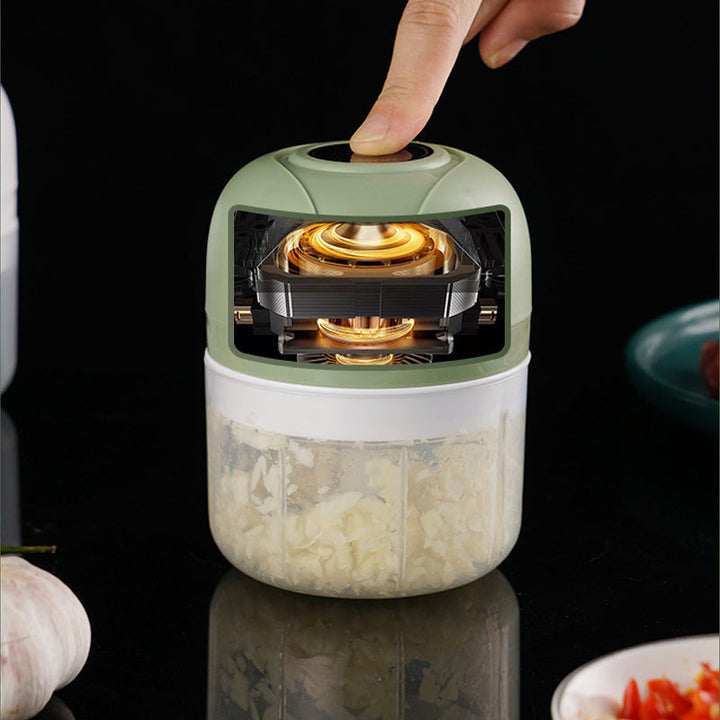 Electric food grinder, USB powered, ideal for making baby food or mincing garlic quickly.