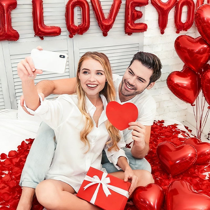 Full display of Valentine's Day party decorations including balloons and banners