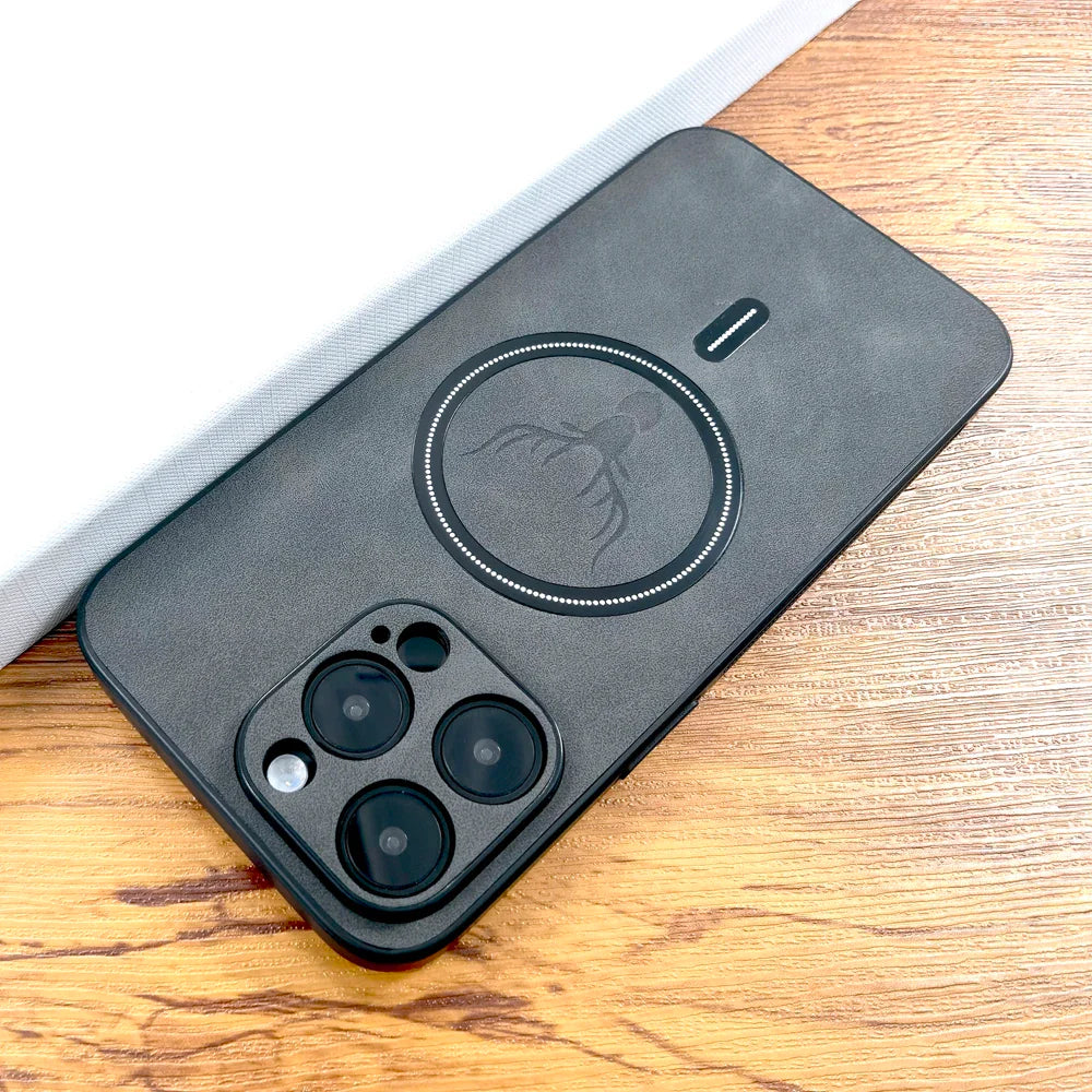 Detailed shot of the deer emblem on a vegan leather MagSafe phone case, showcasing its intricate design