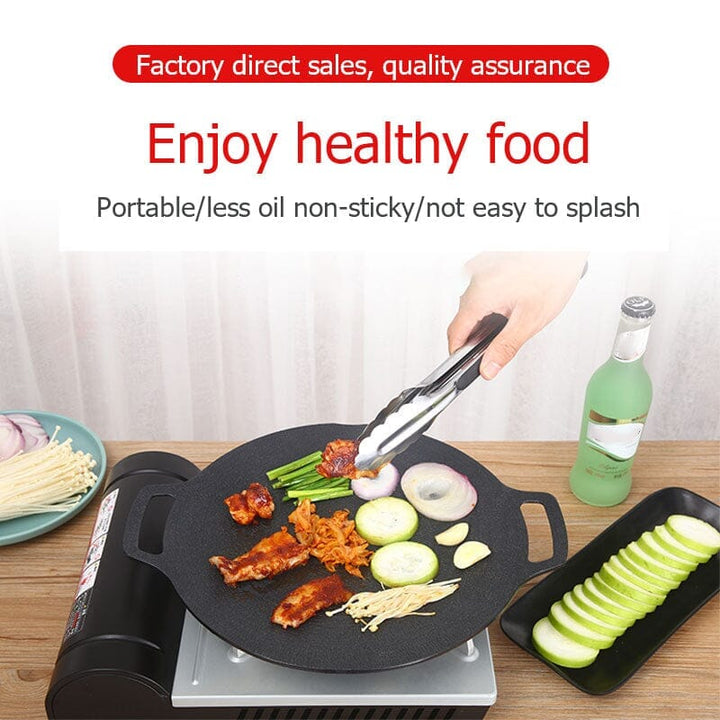 Non-stick round grill pan sizzling with perfectly grilled chicken breasts and vegetables