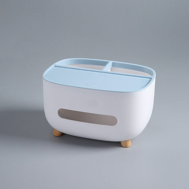 Lifestyle shot of the home organizer tissue box on a desk, filled with everyday essentials.