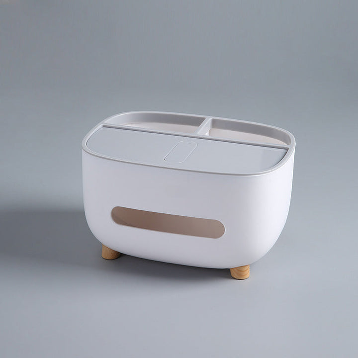 Detail view of the compartments within the multipurpose storage caddy and tissue box.