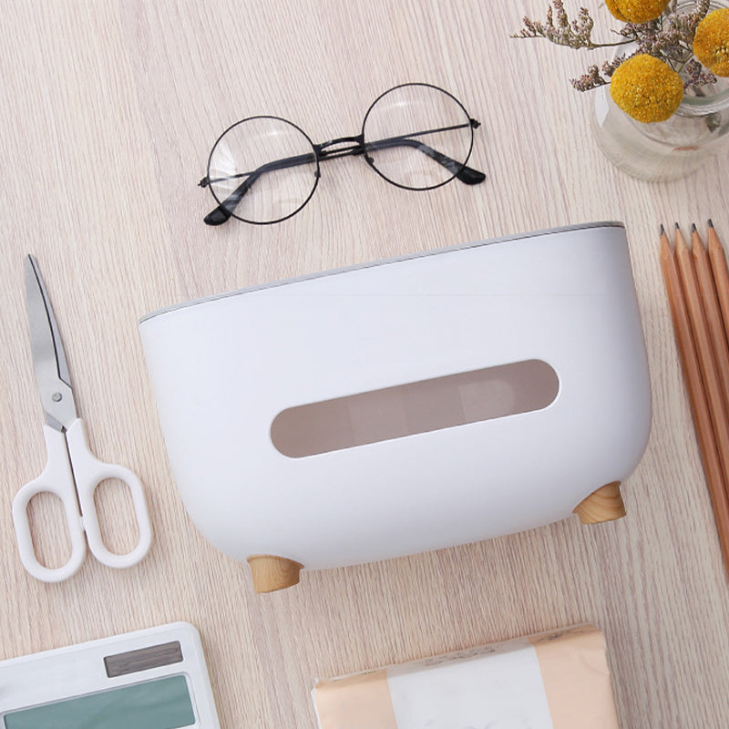 Compact home organization unit: a sleek tissue box combined with a handy storage caddy.