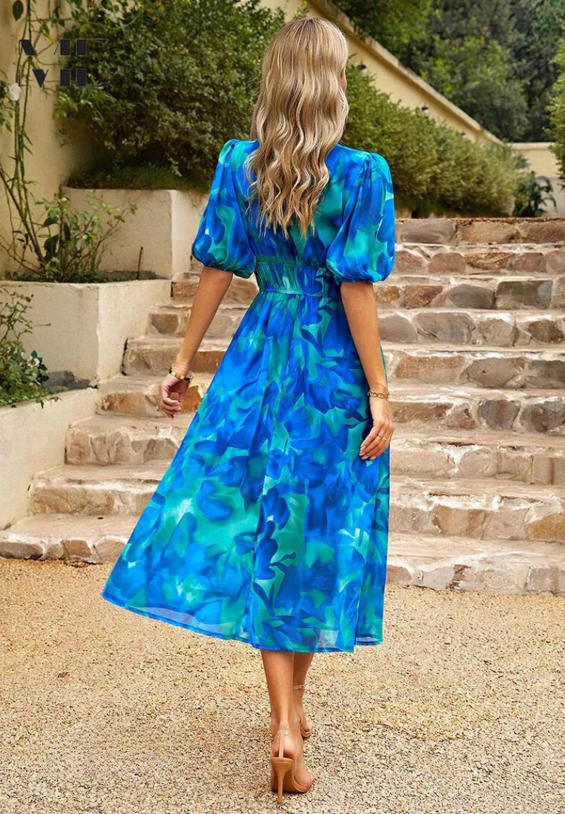 Versatile women's floral A-line midi dress, flowy and elegant for casual or event wear this summer.