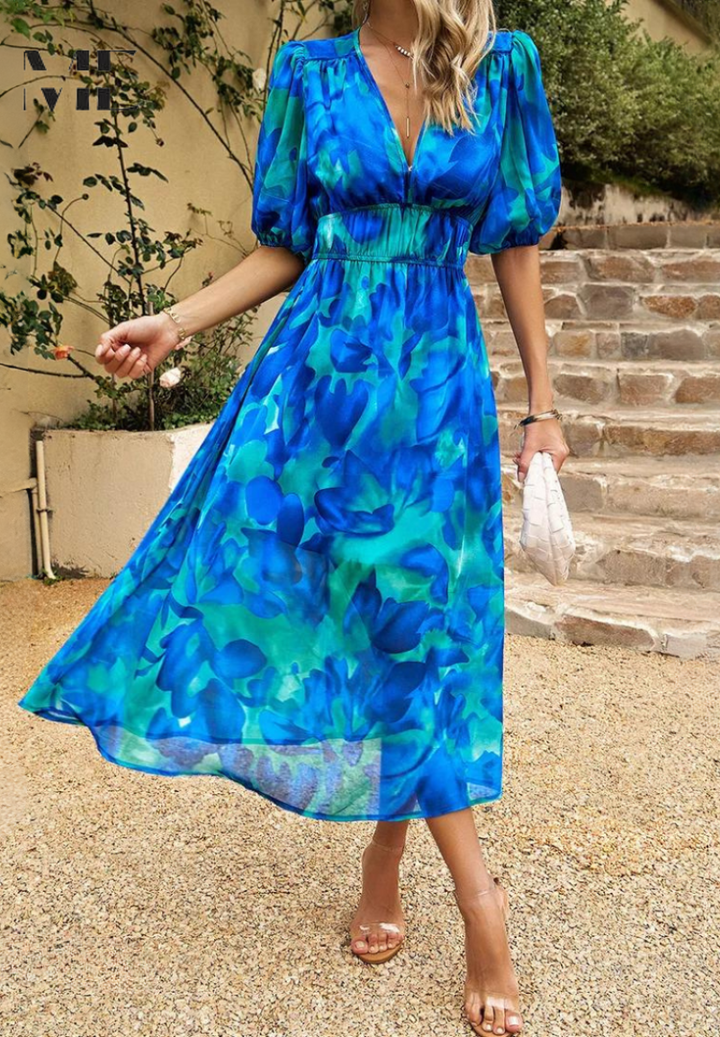 Soft fabric detail of a women's floral A-line midi dress, designed for effortless elegance & summer comfort.
