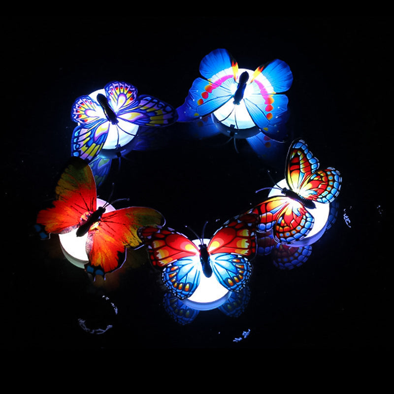 Party scene enhanced with glowing LED butterfly wall decorations, adding flair and ambiance