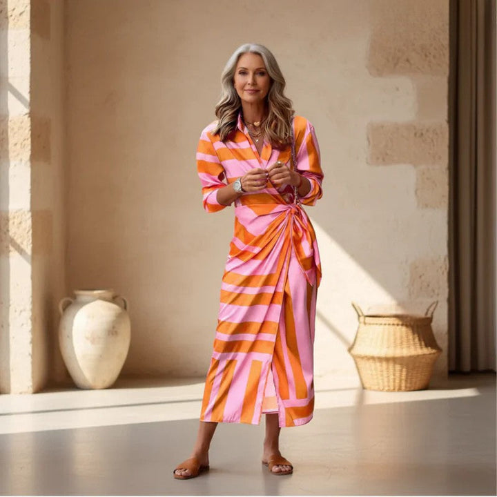 Vibrant printed wrap dress for women, offering effortless style & a flattering fit. Perfect for summer fashion.