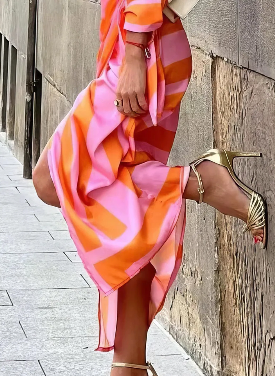 Close-up of a vibrant abstract print on a flattering women's wrap dress, a true statement piece for fashion.