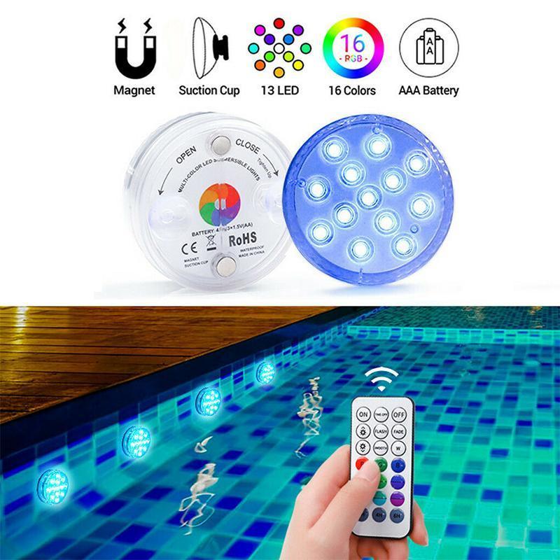 Vibrant RGB submersible LED pool lights with remote control, illuminating a swimming pool.