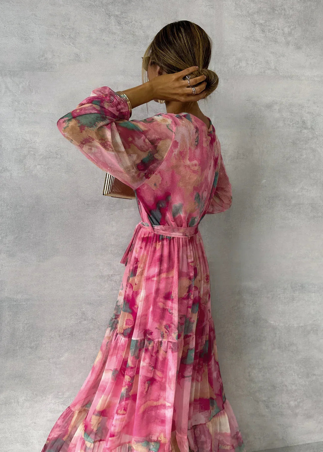Bohemian floral wrap maxi dress with flowing fabric, comfortable fit, v-neck, and ruffle sleeves for women.