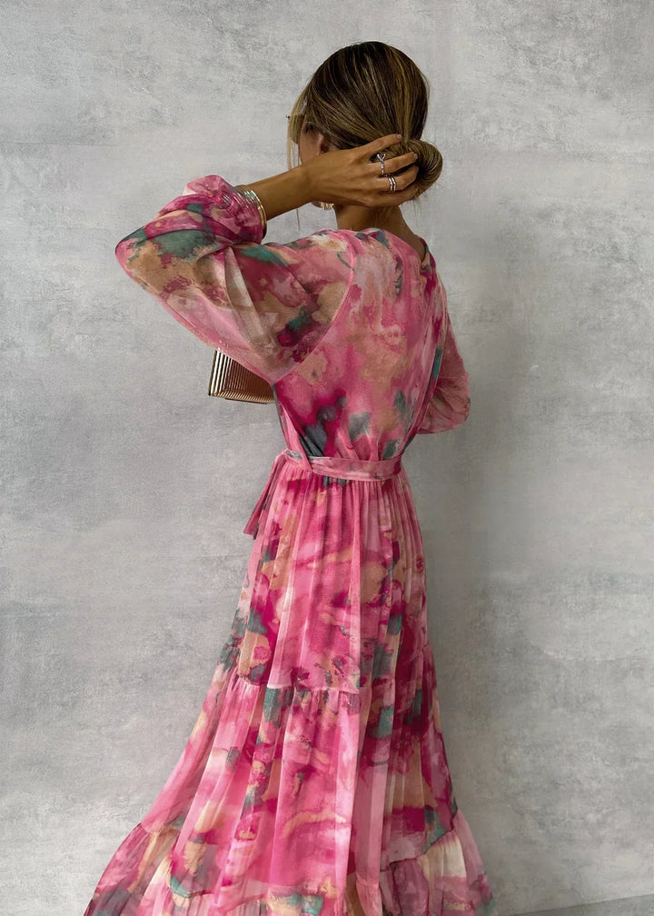 Bohemian floral wrap maxi dress with flowing fabric, comfortable fit, v-neck, and ruffle sleeves for women.