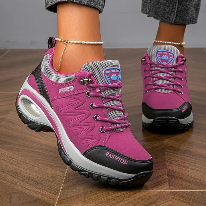Durable women's colorful water-resistant hiking shoes with non-slip grip, lace-up design for all-weather trails.