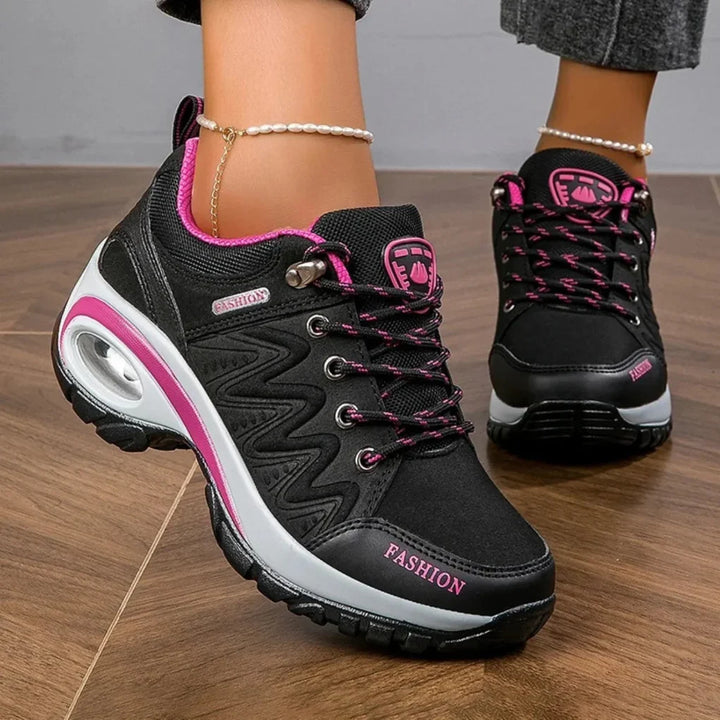 Comfortable women's colorful water-resistant trail shoes for hiking. Non-slip, lace-up design for all outdoor adventures.